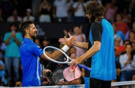 American Reilly Opelka (right) shakes hands with  Serbia's Novak Djokovic after beating him in the quarter finals of the Brisbane International