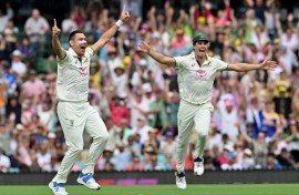 Australia Scott Boland (L) and Pat Cummins celebrate during the fifth Test against India in Sydney