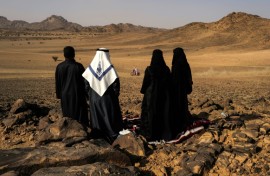 Local residents watch as cars, motorbikes and truck drivers got their 2025 Dakar Rally campaign underway in Bisha, Saudi Arabia 