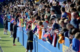 Barcelona's Spanish forward Dani Olmo and teammates sign autographs for fans at an open training session