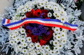 French President Emmanuel Macron and Paris Mayor Anne Hidalgo both laid wreaths near the publication's former offices
