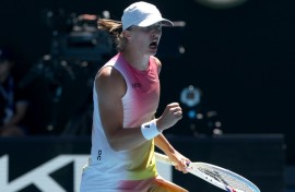 Iga Swiatek celebrates her quarter-final victory over Emma Navarro