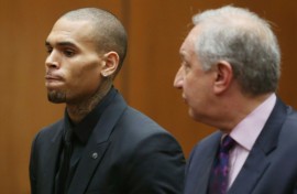 Chris Brown, pictured in court in 2013, has filed a $500 million lawsuit against Warner Bros and others for making a 'defamatory documentary'