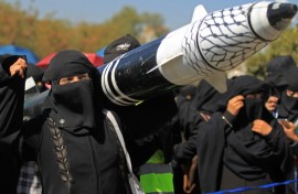 A Yemeni protester holds a mock rocket during an anti-Israel demonstration in the Huthi-controlled capital of Sanaa on January 22, 2025
