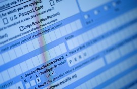 A partially completed passport application, with an 'X' gender marker, is seen on a computer monitor in 2022