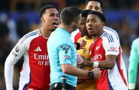 Arsenal's Myles Lewis-Skelly (R) reacts after being sent off at Wolves