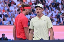 Italy's Jannik Sinner and Germany's Alexander Zverev walk between games during their men's singles final 