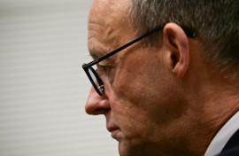 CDU leader Friedrich Merz gets ready to give a statement after German MPs narrowly voted against his party's bill to restrict immigration 