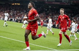 Patrick Dorgu (left)has joined Manchester United from Lecce