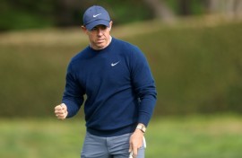 Third-ranked Rory McIlroy of Northern Ireland celebrates sinking an eagle putt at the 14th hole in the final round on his way to victory at the PGA Pebble Beach Pro-Am