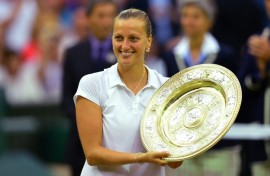 Czech Republic's Petra Kvitova holds the Wimbledon winner's trophy in 2014