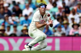 Pat Cummins takes a catch in the recent Test series against India
