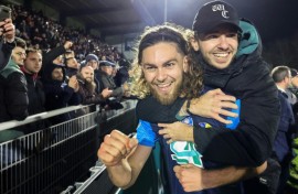 Shock victory: Stade Briochin's Leo Yobe celebrates with a fan