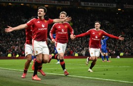 Manchester United defender Harry Maguire (left) celebrates his winning goal against Leicester