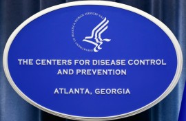 A sign with the logo for the Centers for Disease Control and Prevention headquarters in Atlanta, Georgia