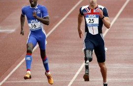 John McFall, right, running in the 2007 Paralympics. He has now been cleared to fly to the ISS