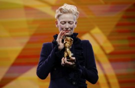 Tilda Swinton lashed out at 'greed-addicted governments' in her acceptance speech for a special award at the Berlin Film Festival