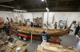 Veterans put the finishing touches to a Viking longboat built from solid oak using authentic Scandinavian plans as part of a project to help restore their mental health 