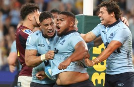 NSW Waratahs' Siosifa Amone (C) celebrates his winning try against the Otago Highlanders 