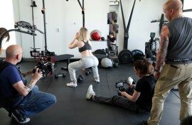 Adult movie director Casey Calvert (seated) and Eli Cross (L) rehearse for a scene with pornographic actress Lilly Bell (C) in Northridge, California