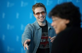 Robert Pattinson and South Korean director Bong Joon Ho pose during a photo call 