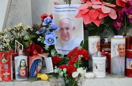 Nuns sing at the statue of John Paul II outside the Gemelli hospital where Pope Francis is hospitalized in Rome 