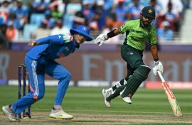 Running man: Pakistan's Saud Shakeel (R) was his team's top scorer 