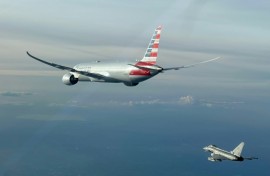 This handout picture taken and released by the Italian Air Force shows the American Airlines flight being escorted by a fighter jet