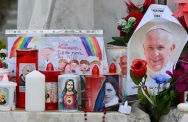 Candles, flowers and portraits of Pope Francis have been laid at the statue of the late John Paul II outside the Gemelli hospital where Pope Francis is hospitalized with double pneumonia