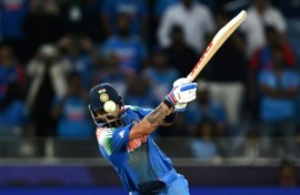India's Virat Kohli hits the winning boundary against Pakistan in Dubai