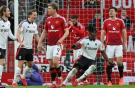 Calvin Bassey (2R) celebrates his FA Cup goal for Fulham against Manchester United at Old Trafford
