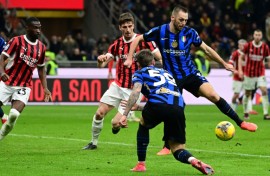 Inter Milan's Dutch defender Stefan de Vrij controls the ball to score his team's first goal during the Italian Serie A football match between AC Milan and Inter at San Siro stadium in Milan last month