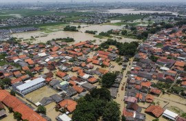 An aerial picture shows a flooded residential area after some rivers overflowed following heavy rain in Bekasi, a suburb of Jakarta, on March 5, 2025
