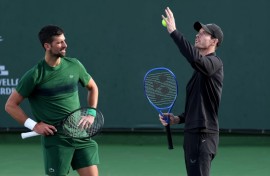 Novak Djokovic and coach Andy Murray work on the Serbian star's serve during practice prior at the Indian Wells ATP Masters