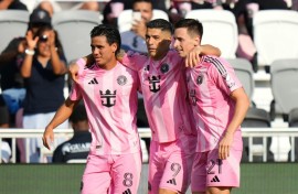 Tadeo Allende #21 of Inter Miami celebrates with teammates Luis Suárez #9 and Telasco Segovia #8 after scoring in the 1-0 win over Charlotte in MLS on Sunday.
