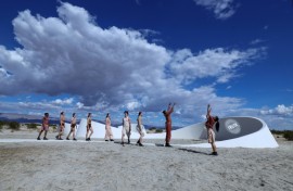 Dancers perform in front of  French-American artist Sarah Meyohas's piece 'Truth Arrives in Slanted Beams' ahead of the opening of the Desert X exhibit spread across California's Coachella Valley 