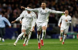 Kylian Mbappe celebrates after Real Madrid beat Atletico Madrid in the Champions League on Wednesday