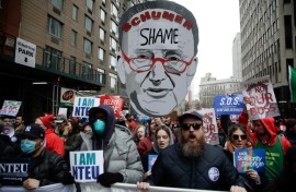 Demonstrators take part in a "March to Stop the Cuts" protest in New York 