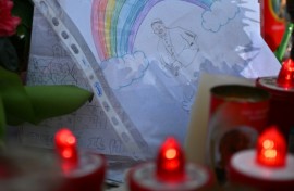 A drawing depicts Pope Francis under a rainbow outside the Gemelli hospital