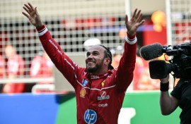 Lewis Hamilton celebrates winning the sprint race of the Formula One Chinese Grand Prix