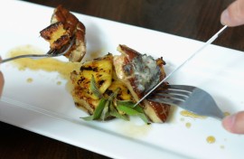 Customers eat gourmet food made with foie gras at Hot's Kitchen during a "Farewell Fois Gras" event on June 29, 2012 in Hermosa Beach, California