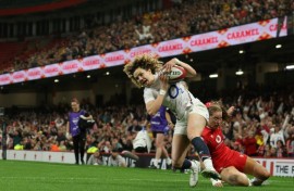 Try time: England full-back Ellie Kildunne scores one of her three tries in a Women's Six Nations win over Wales in Cardiff