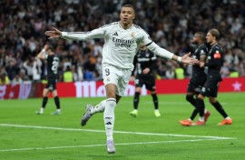 Real Madrid's French forward Kylian Mbappe struck twice as Los Blancos caught up with Barcelona in La Liga