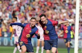Barcelona striker Robert Lewandowski (R) hit a brace in the win over Girona on Sunday in La Liga