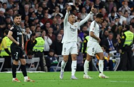 Real Madrid's French forward Kylian Mbappe (C) celebrates scoring his second goal against Leganes