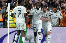 Real Madrid's German defender Antonio Rudiger (C) celebrates scoring his team's fourth goal against Real Sociedad