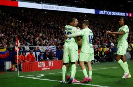 Barcelona's Spanish forward Ferran Torres (2L) celebrates scoring against Atletico Madrid in the Copa del Rey semi
