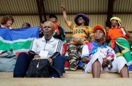 The crowd applauded as teams entered the stadium hand in hand with young mascots