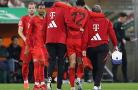Bayern Munich midfielder Jamal Musiala is helped from the field with a hamstring injury