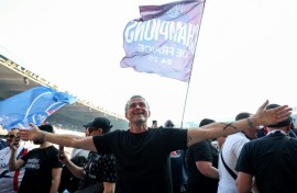 PSG coach Luis Enrique leads the celebrations after his side clinched the Ligue 1 title on Saturday